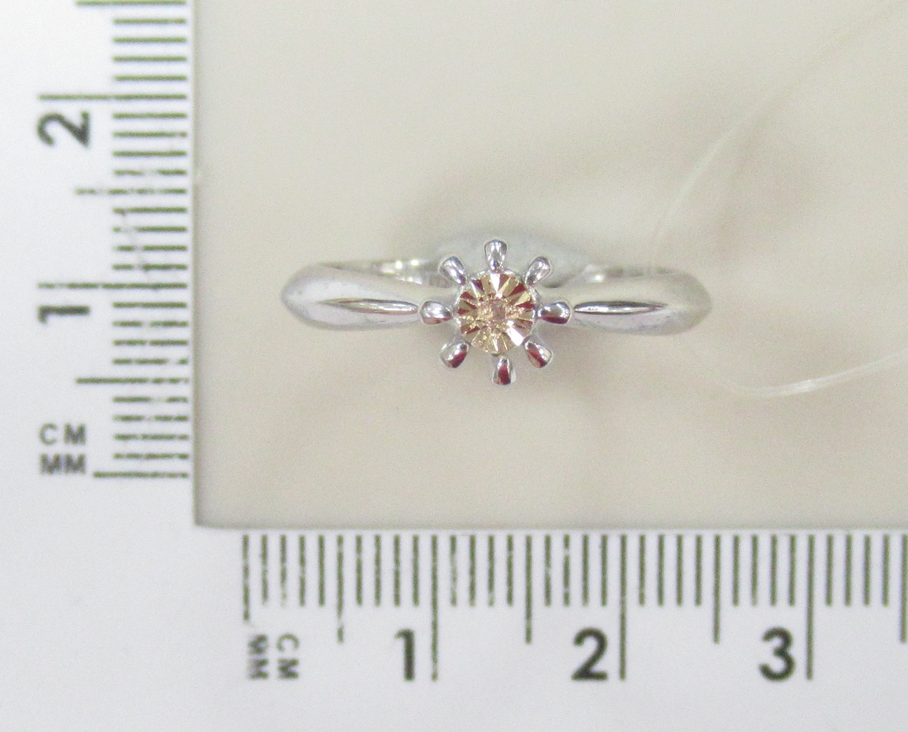 Серебряное кольцо с бриллиантом и золотом